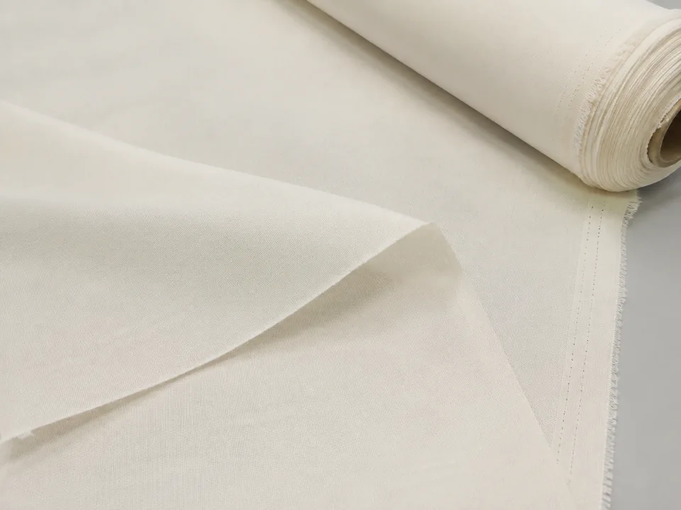 Off-white microfiber greige and PFD fabric roll and spread