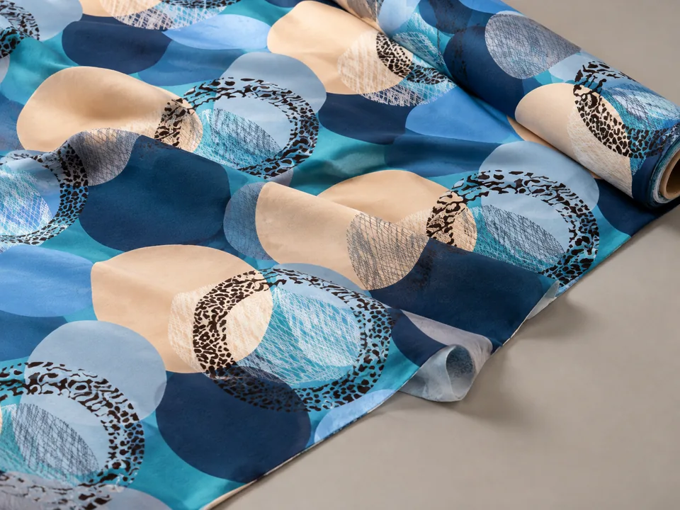 Blue and teal circle disperse-printed brushed polyester fabric